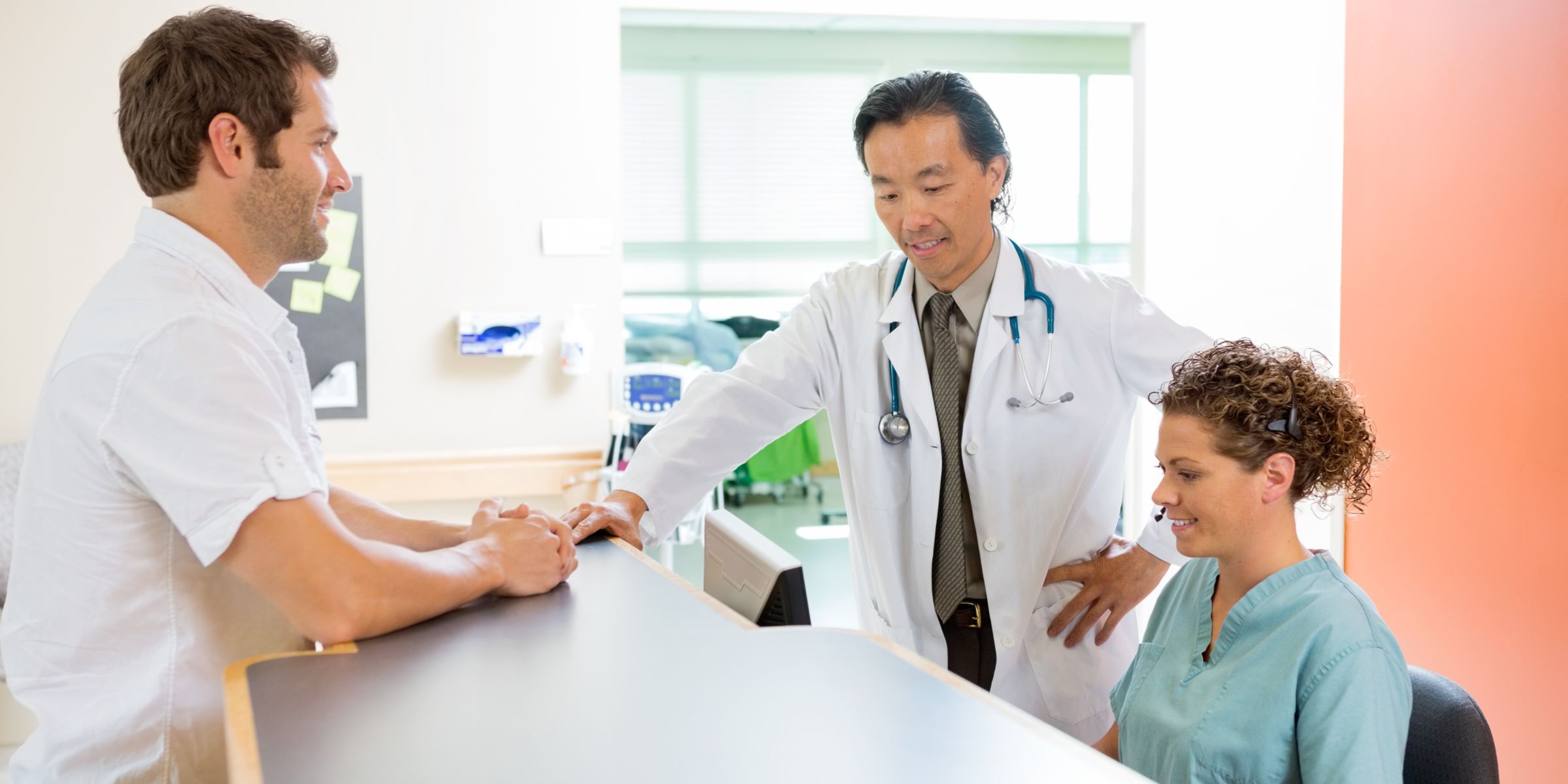 Doctors talking at desk