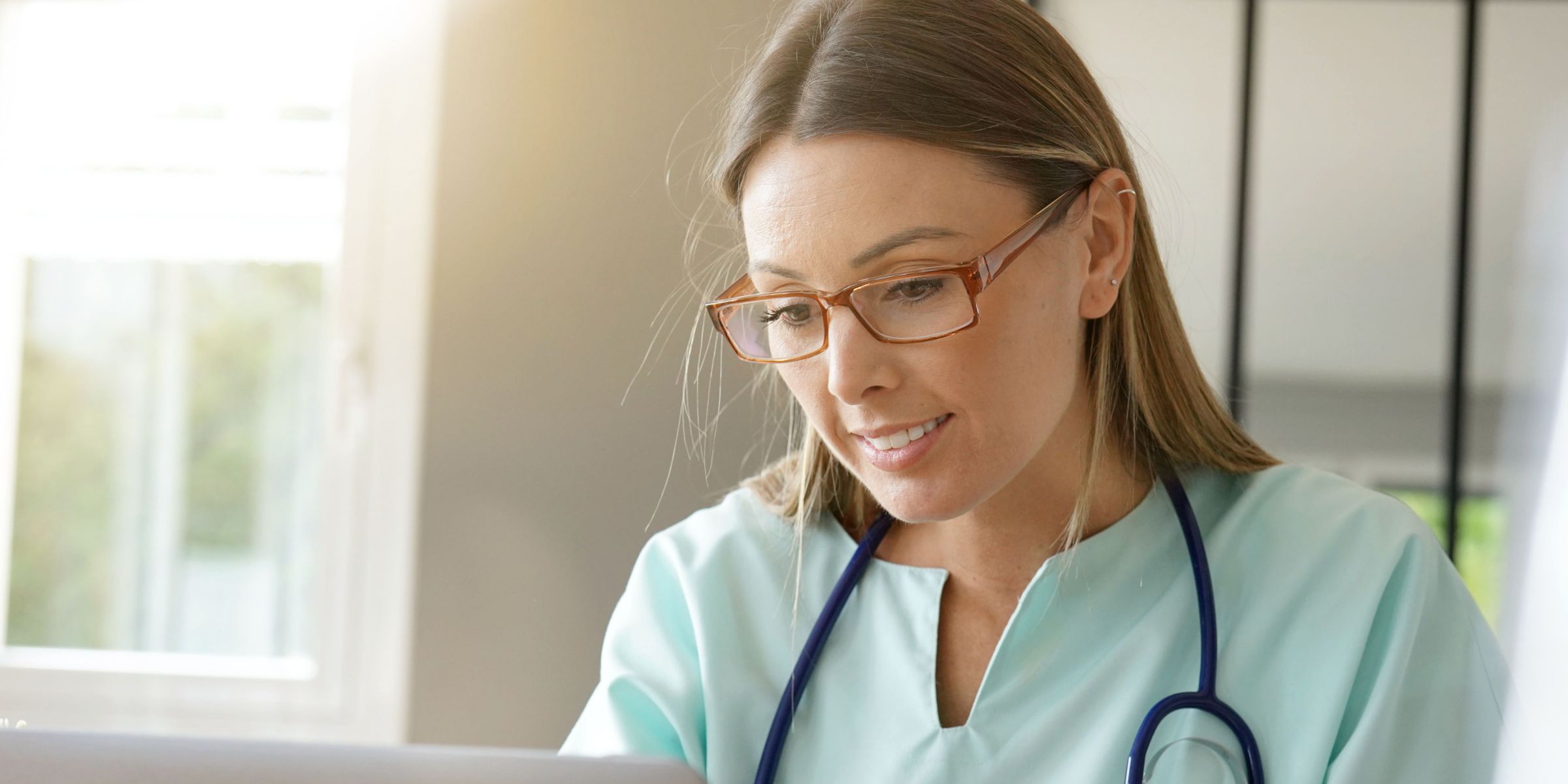 Doctor looking at computer