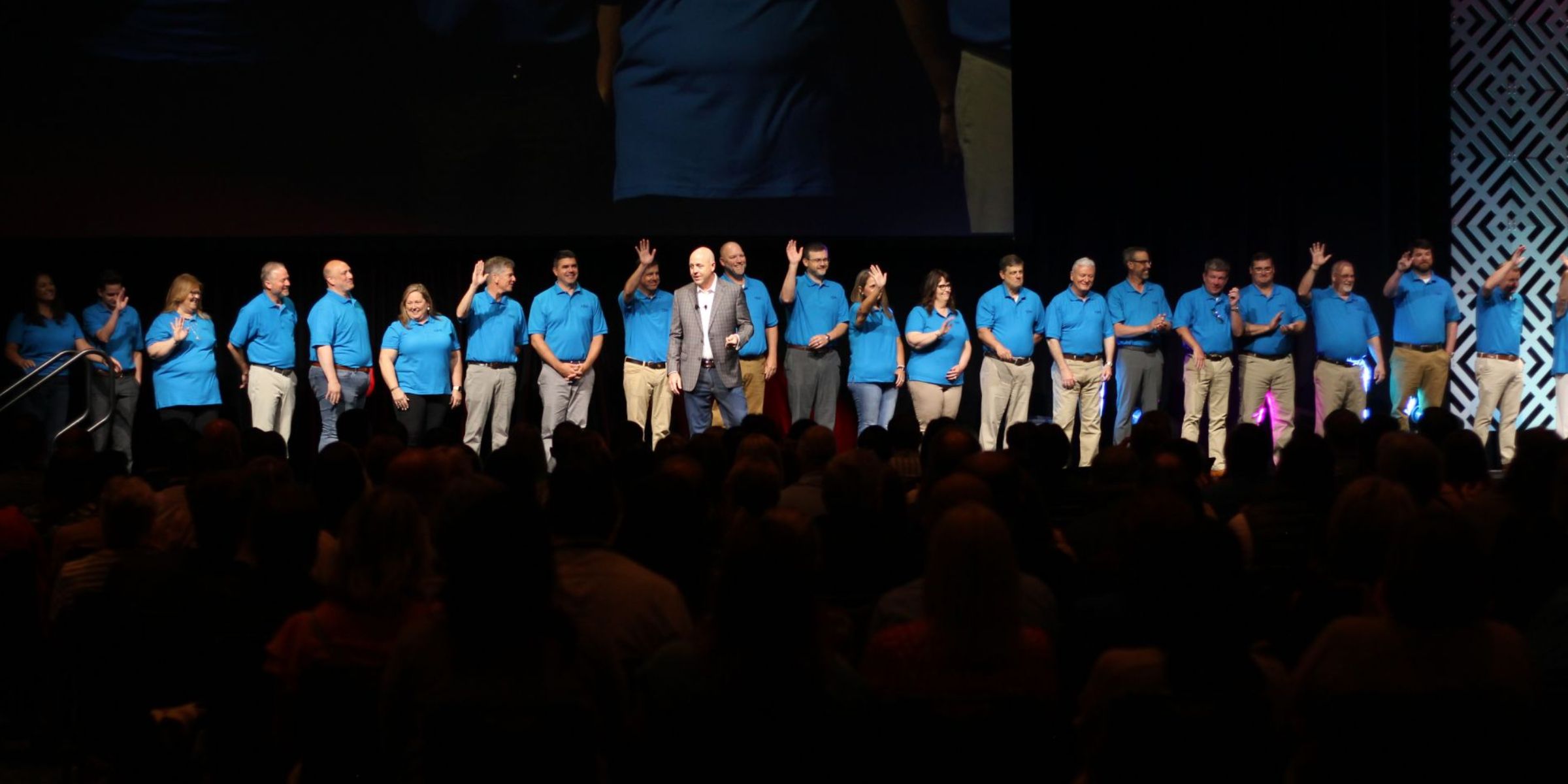 People on stage at a conference