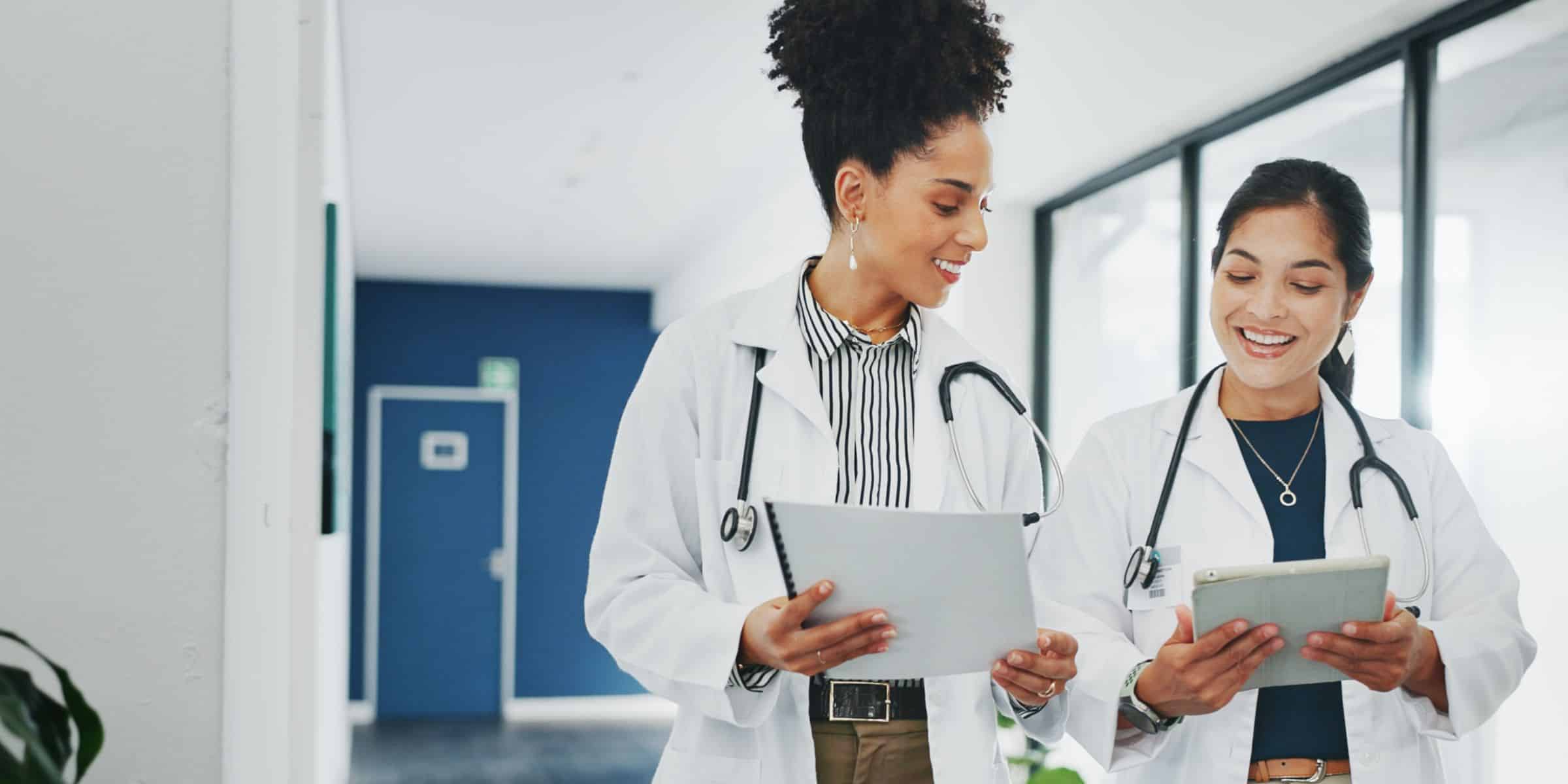 Doctors walking with charts