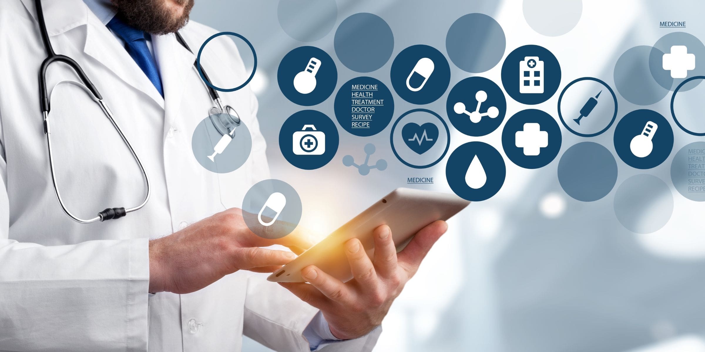 Male doctor on tablet with healthcare cloud icons